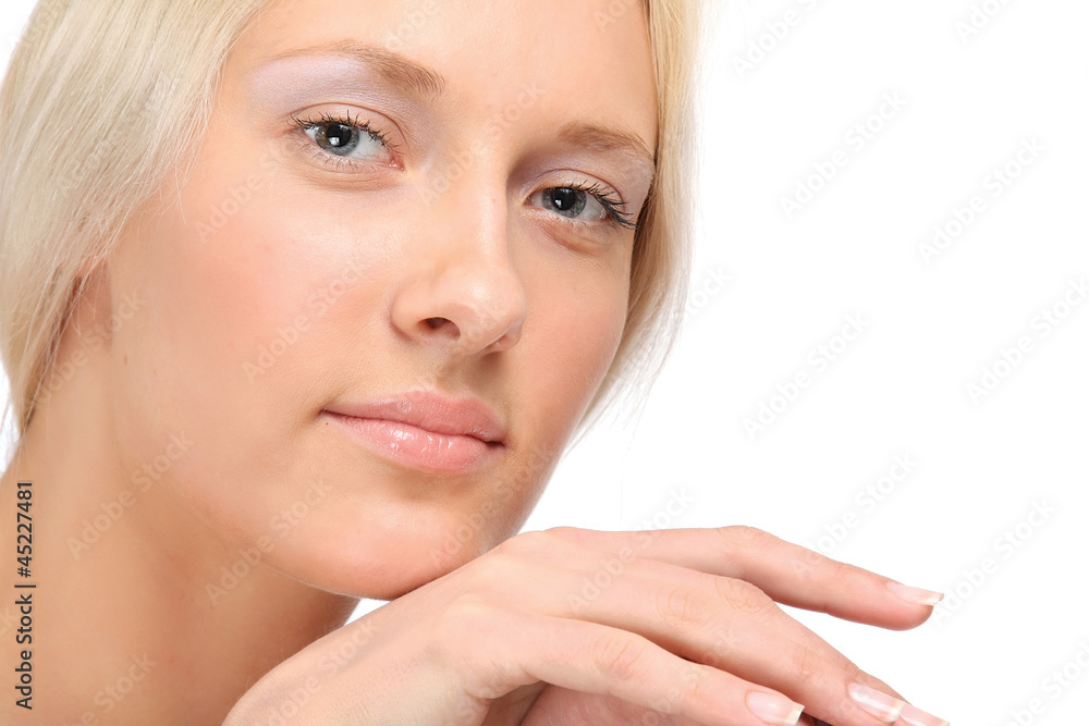 A beautiful young woman resting her chin on her hand