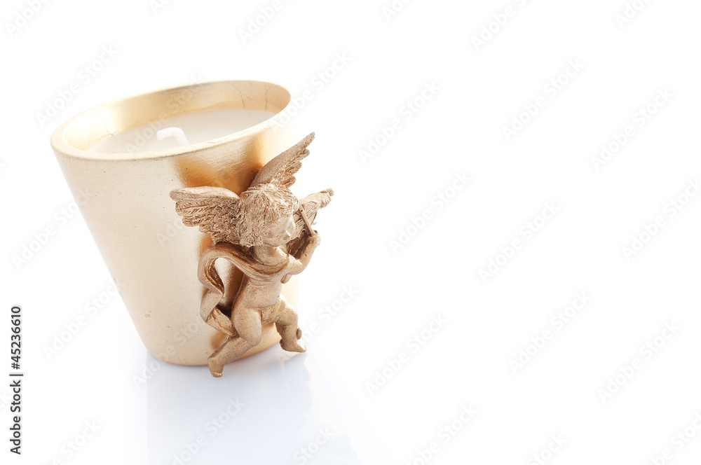 Fototapeta premium candle decorated with a winged angel isolated on white