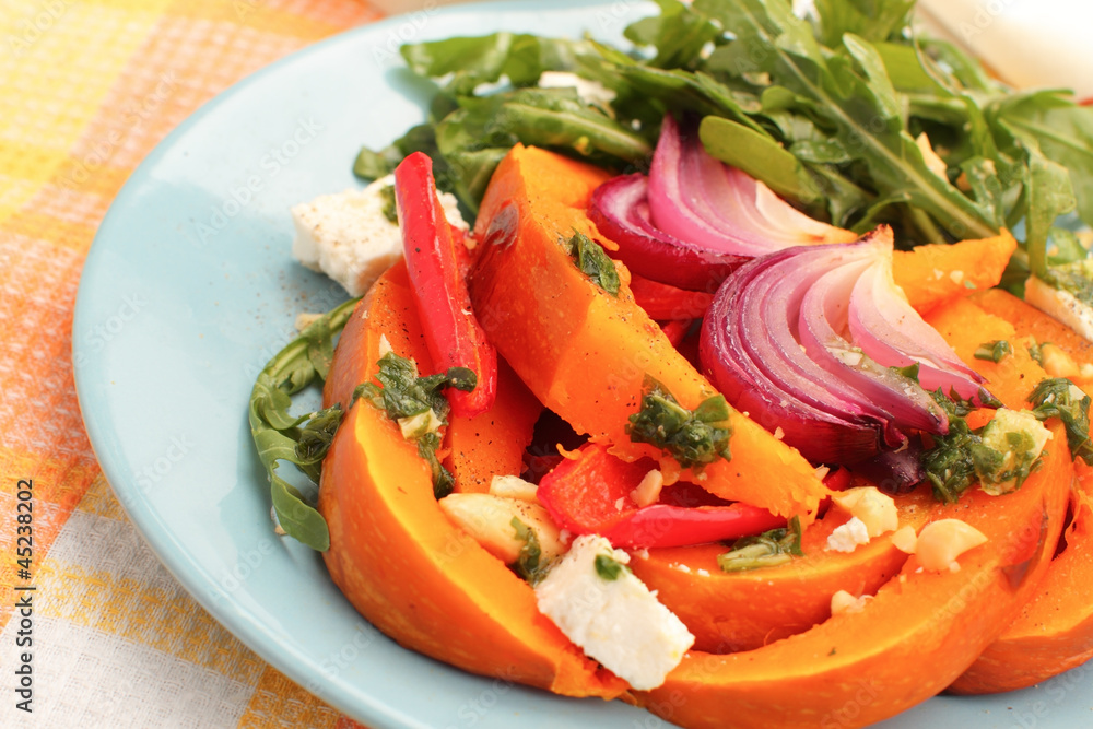 Pumpkin salad with arugula, parmesan and pesto Pumpkin salad with arugula, parmesan and pesto