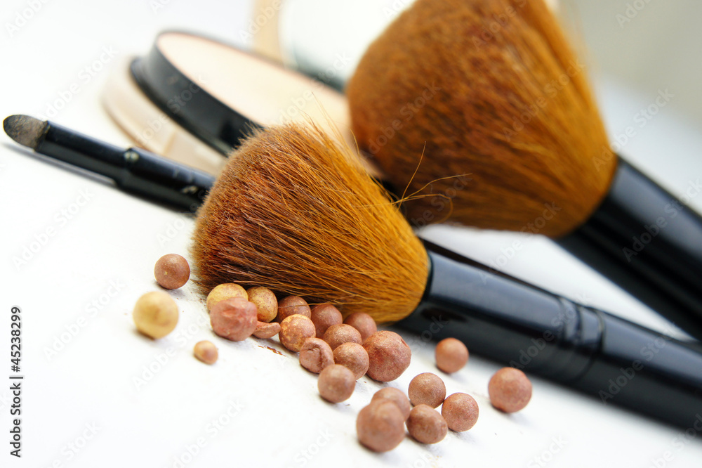 Makeup foundation, powder, bronzer and brushes Makeup foundation, powder, bronzer and brushes