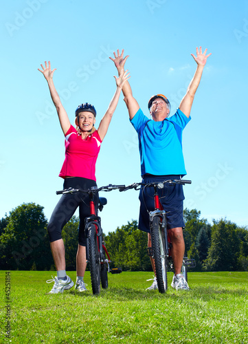 Happy senior couple cyclist.