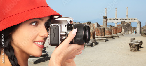 Photography Tourist woman with a camera.