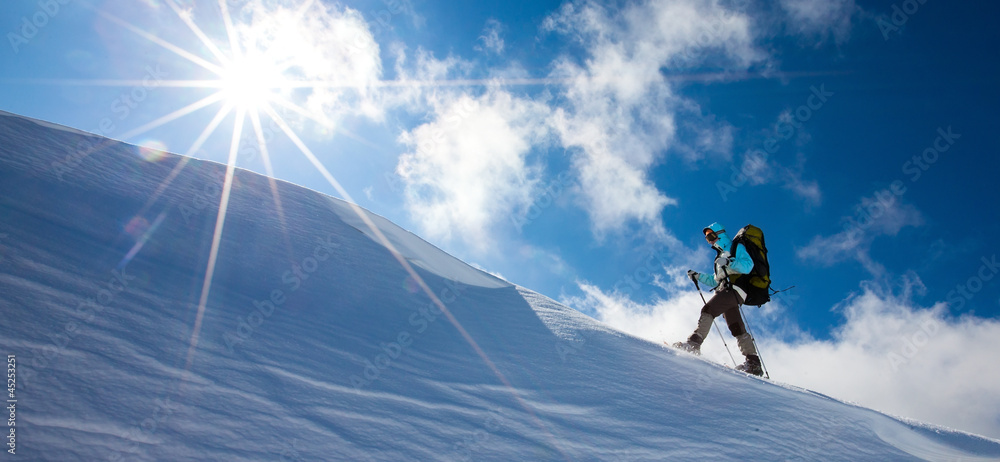 Hiker in winter mountains