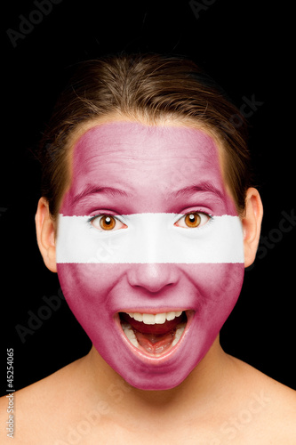 girl with latvian flag painted on her face