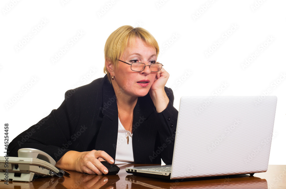 Mature businesswoman working with laptop Mature businesswoman working with laptop