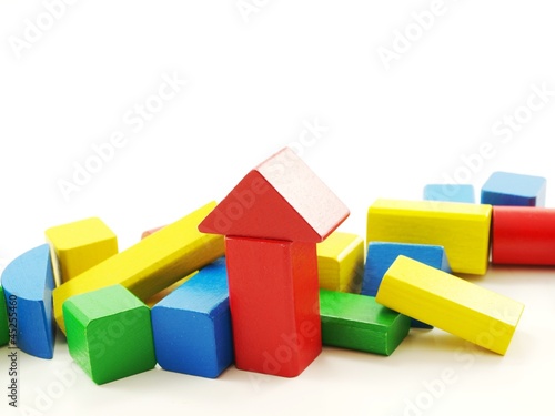 Pile of colorful wooden bricks  isolated towards white