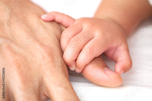 Baby hand hold father hand