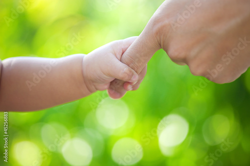 Baby hand hold father hand