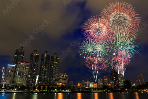 Fireworks over building cityscape,