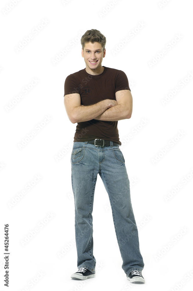 young man smiling arms crossed at camera. young man smiling arms crossed at camera.