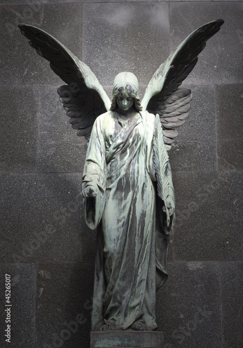 Fototapeta Monument of old angel on cemetery in Warsaw