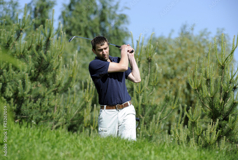 Golf player strikes a good shot Golf player strikes a good shot