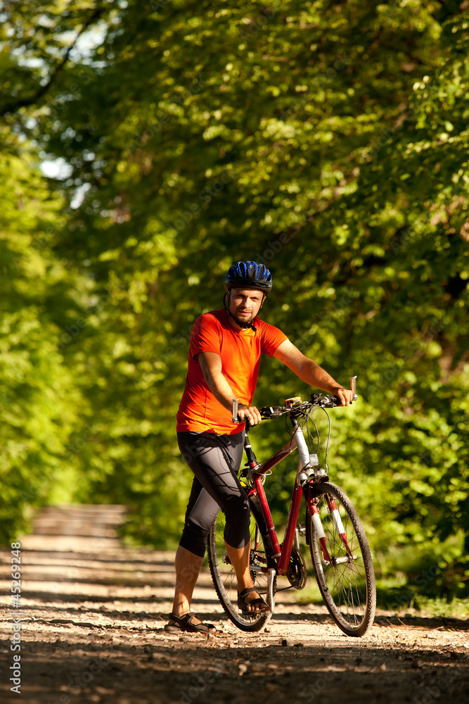 Biker on the forest road