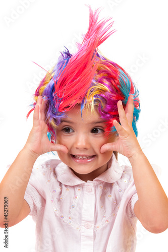Little girl with colorful wigs