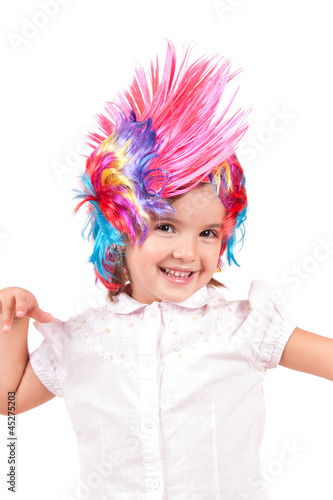 Little girl with colorful wigs