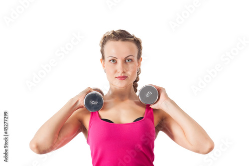 Athletic young woman with dumbbell