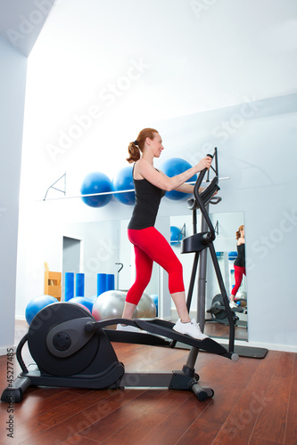 Aerobics cardio training woman on elliptic crosstrainer