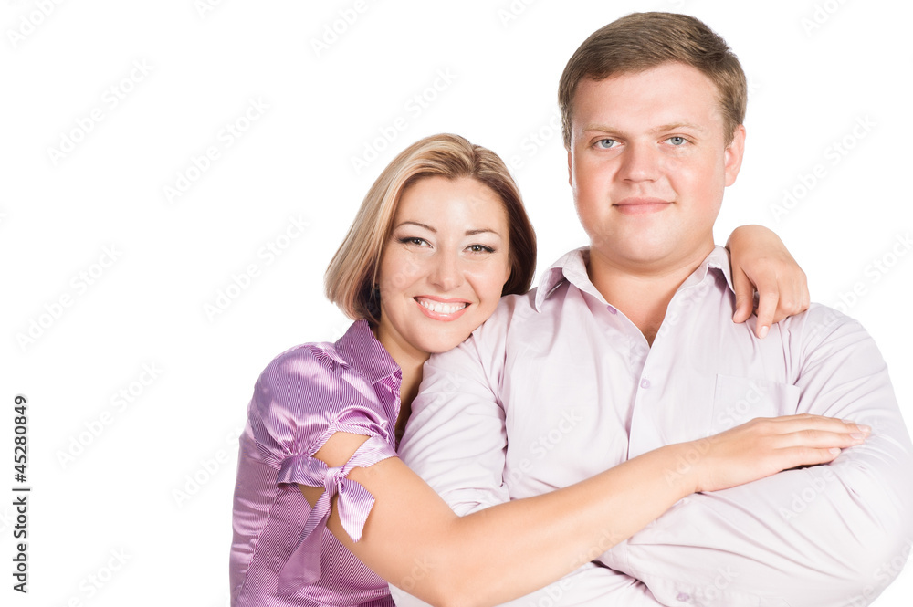 Portrait of happy young woman embracing her husband - isolated o Portrait of happy young woman embracing her husband - isolated o