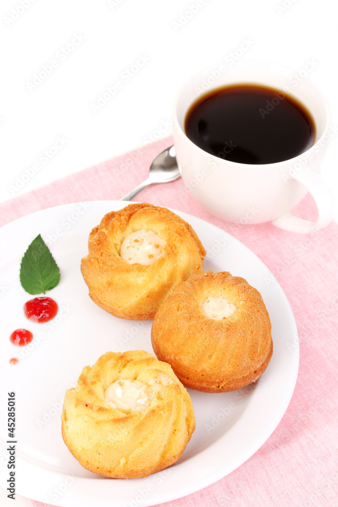 Appetizing cupcakes with cream isolated on white Appetizing cupcakes with cream isolated on white