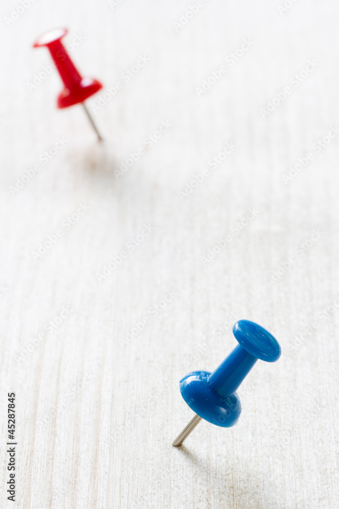 Blue and red push pins Blue and red push pins