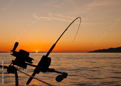 Down Rigging Fishing Rod At Sunset