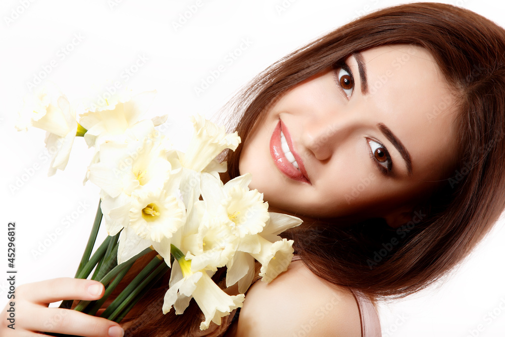 beautiful teen girl smiling and with flower narcissus