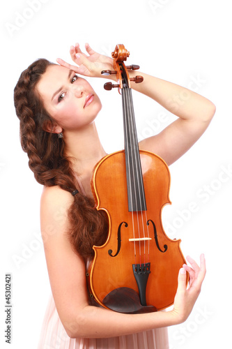 Attractive violinist posing with violin isolated on white