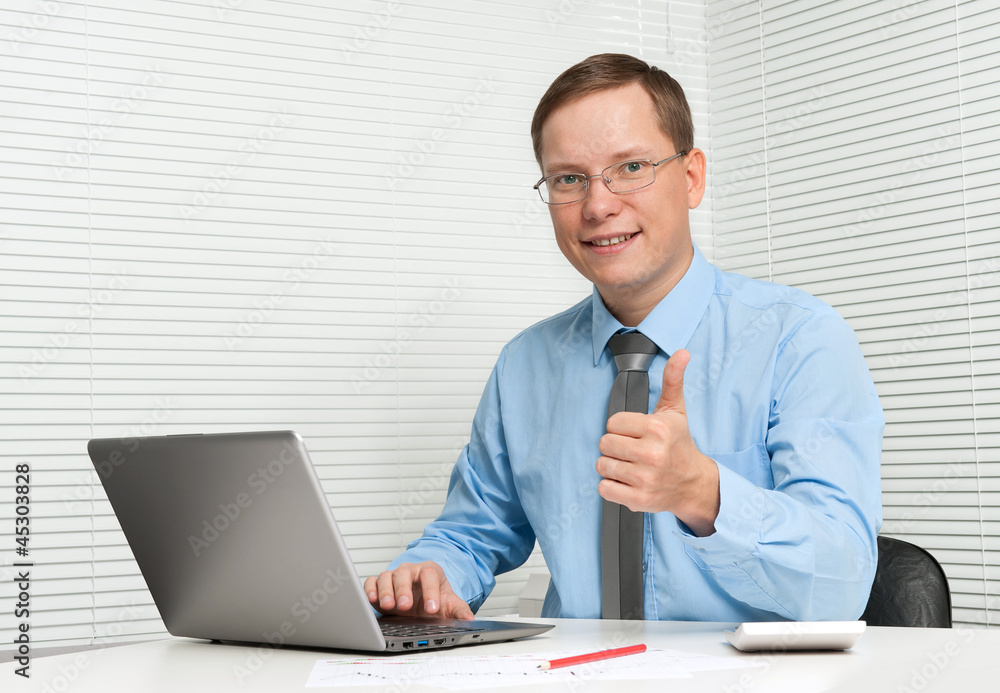 business man showing thumbs up at office business man showing thumbs up at office