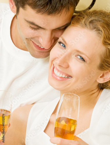 Cheerful couple with champagne