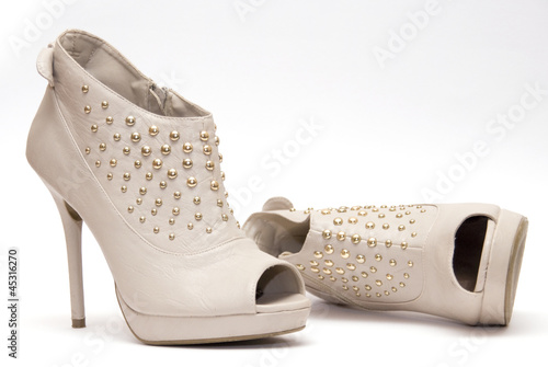 Studded Nude High Heels Isolated on a White Background