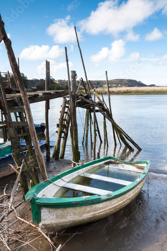 Boat aground and a pier