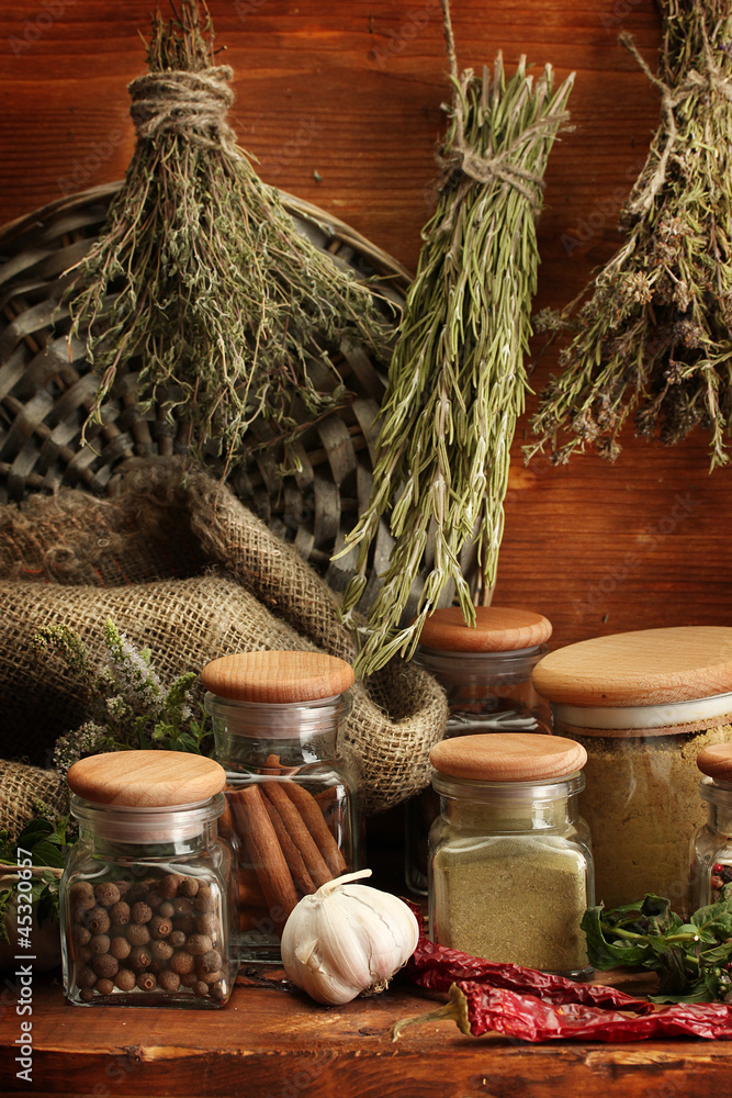 dried herbs, spices and and pepper, on wooden background dried herbs, spices and and pepper, on wooden background