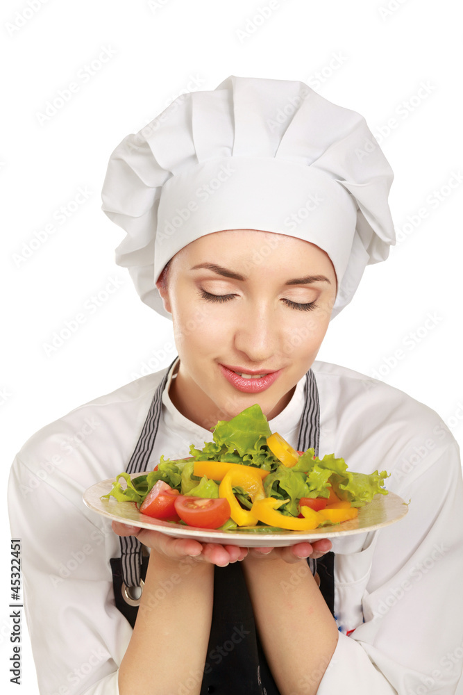 Pretty cook chief holding salad, isolated on white background Pretty cook chief holding salad, isolated on white background