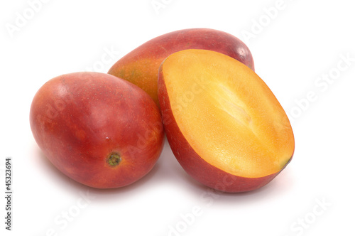 Mango and mango section isolated on white