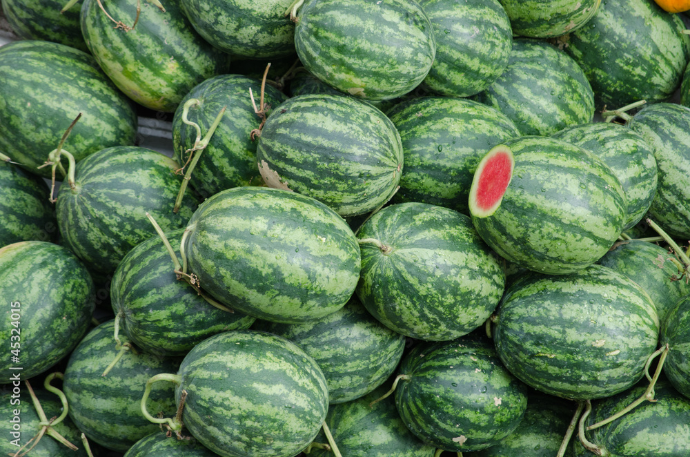 A watermelon stall with one was cut, Mekong Delta, Vietnam A watermelon stall with one was cut, Mekong Delta, Vietnam