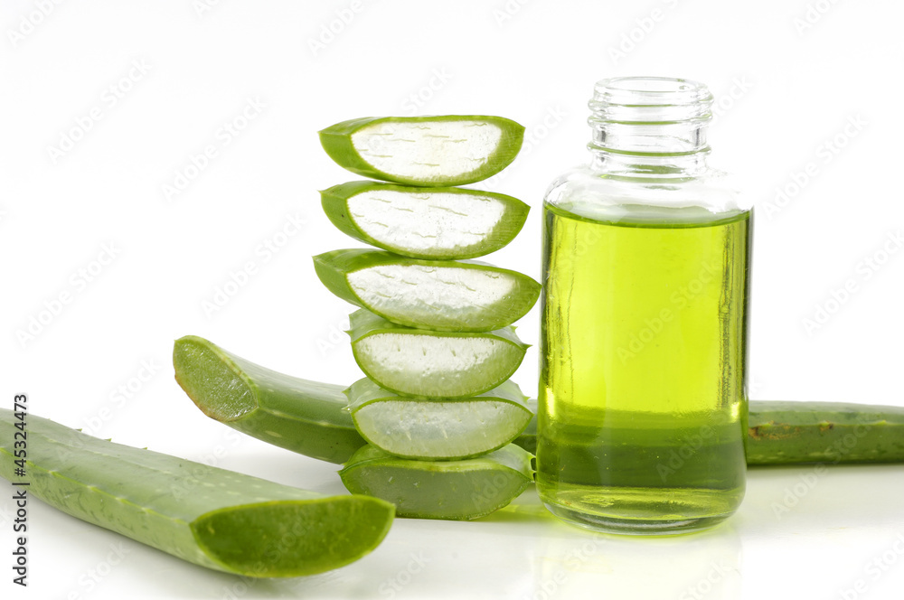 bottle of cosmetic with fresh aloe vera bottle of cosmetic with fresh aloe vera