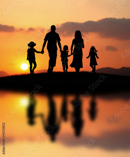 happy family at sunset