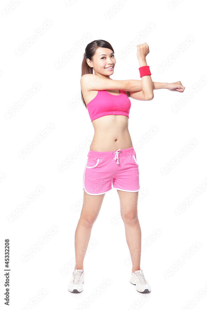 Fit woman stretching her arm to warm up Fit woman stretching her arm to warm up