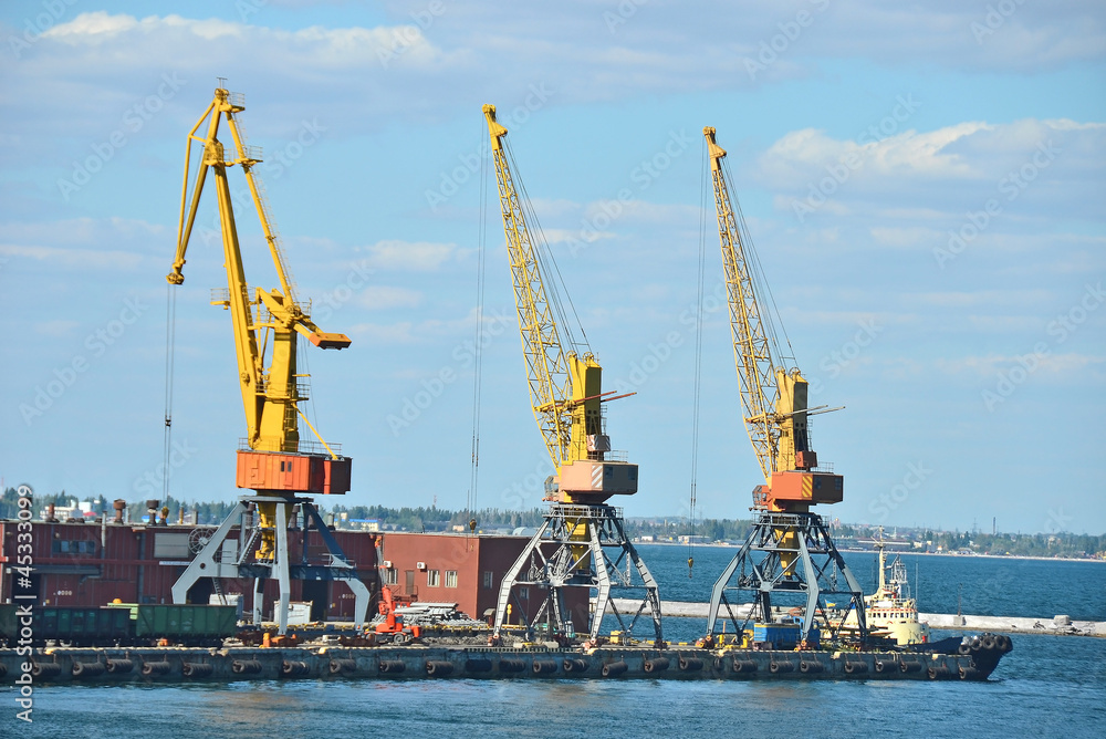 Tugboat and freight train under port crane, Odessa, Ukraine