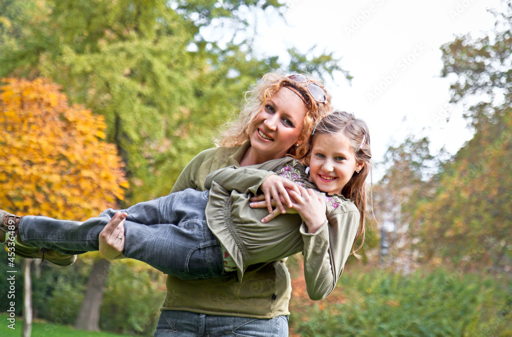 Fototapeta premium Happy family relaxing outdoors In park