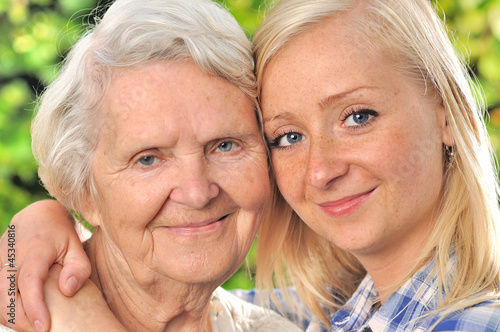 Obraz na płótnie Grandmother and granddaughter. Senior and young woman outdoors. w salonie