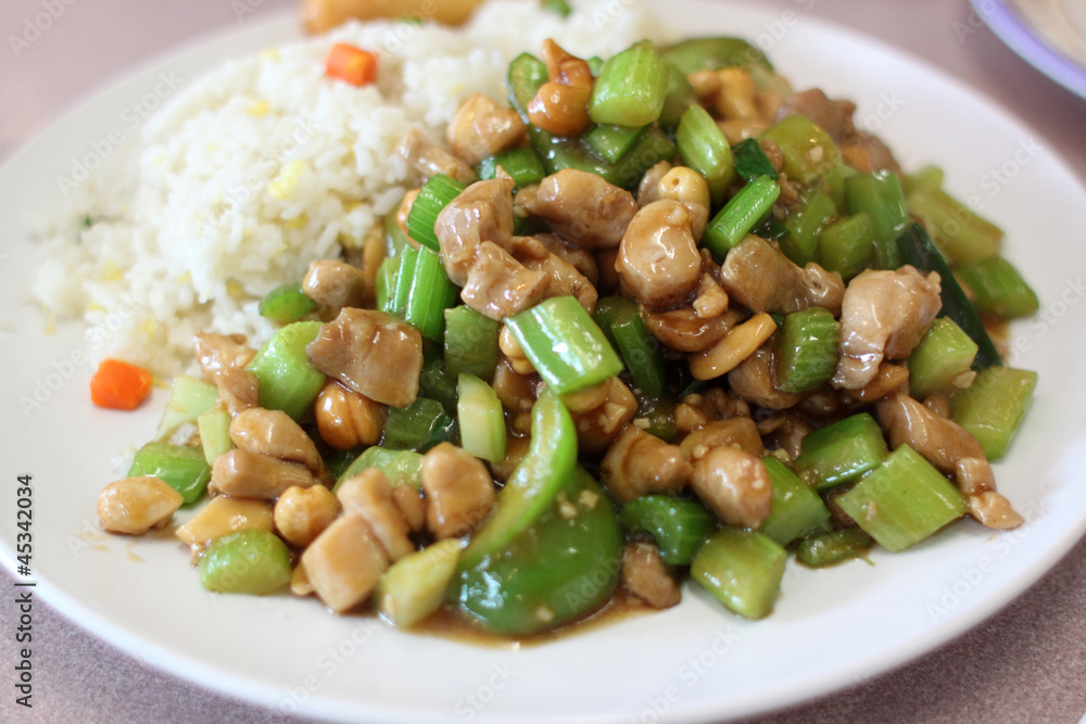 Plate of cashew chicken at a Chinese restaurant. Plate of cashew chicken at a Chinese restaurant.