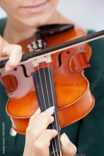 Young woman playing the violin