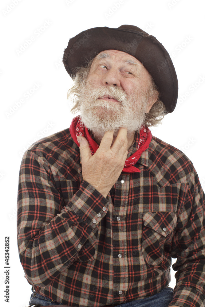 Old cowboy thinks and scratches whiskers Old cowboy thinks and scratches whiskers