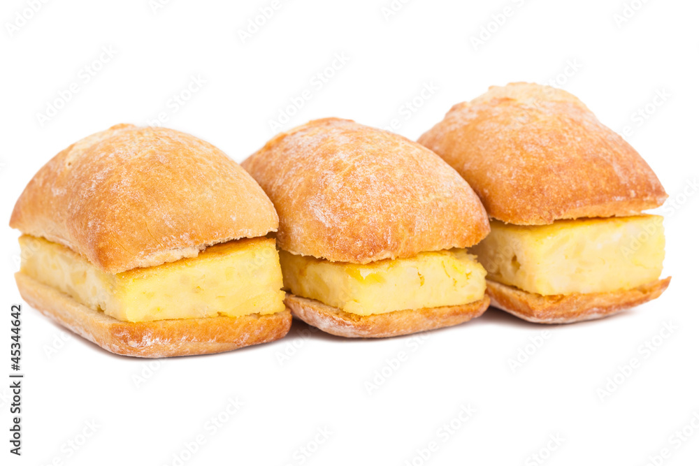 Litlle sandwiches of Spanish tortilla (omelette) on white