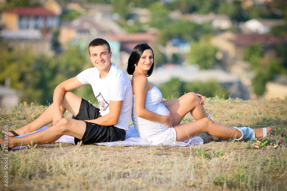 young family with a sun on the nature young family with a sun on the nature