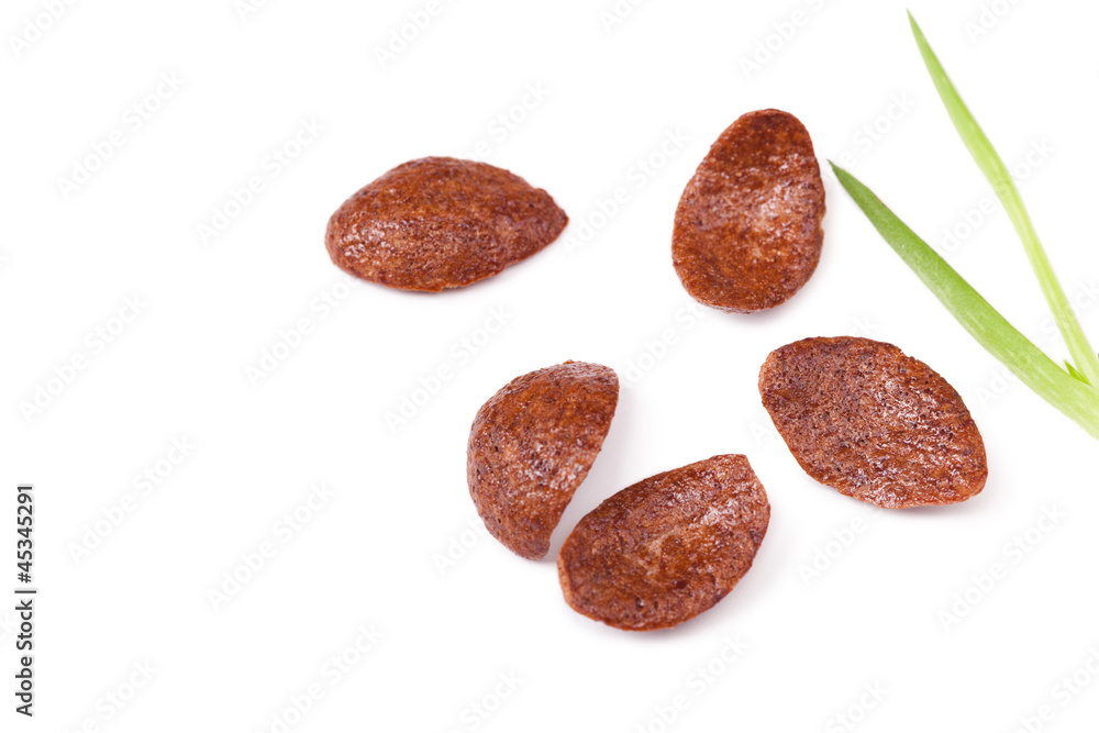 Grains of chocolate cereal on white, close up Grains of chocolate cereal on white, close up