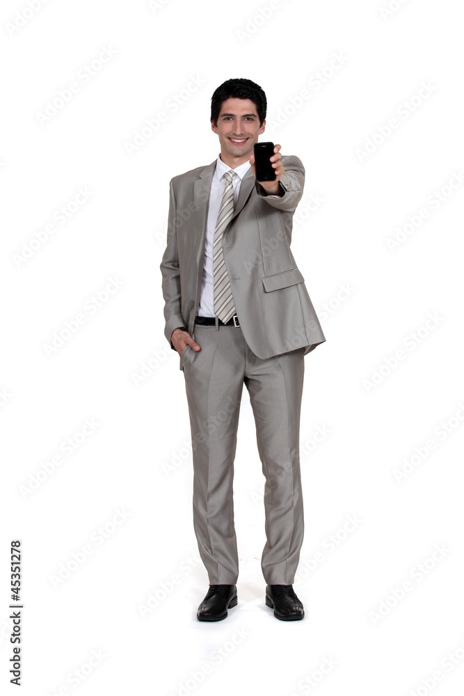 Businessman displaying mobile telephone Businessman displaying mobile telephone