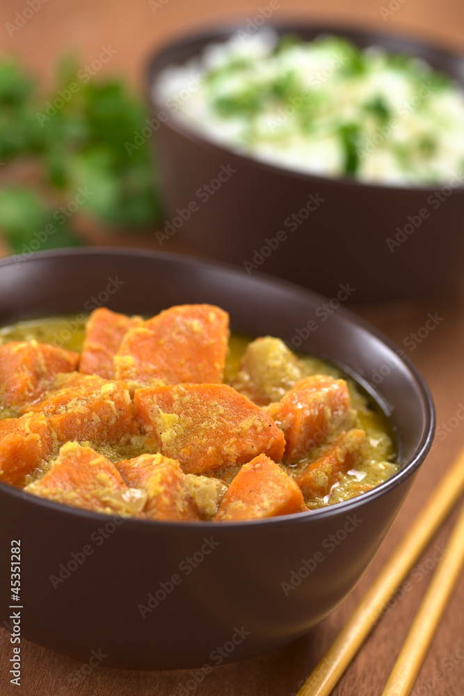 Bowl of vegetarian sweet potato and coconut curry Bowl of vegetarian sweet potato and coconut curry