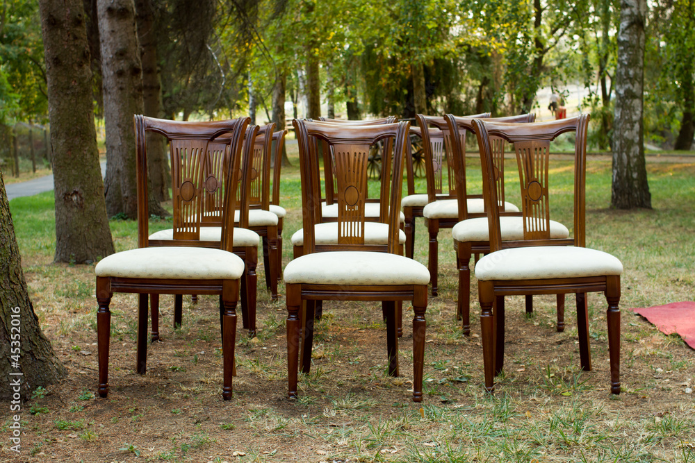 wooden chairs mounted for a wedding reception on the garden wooden chairs mounted for a wedding reception on the garden